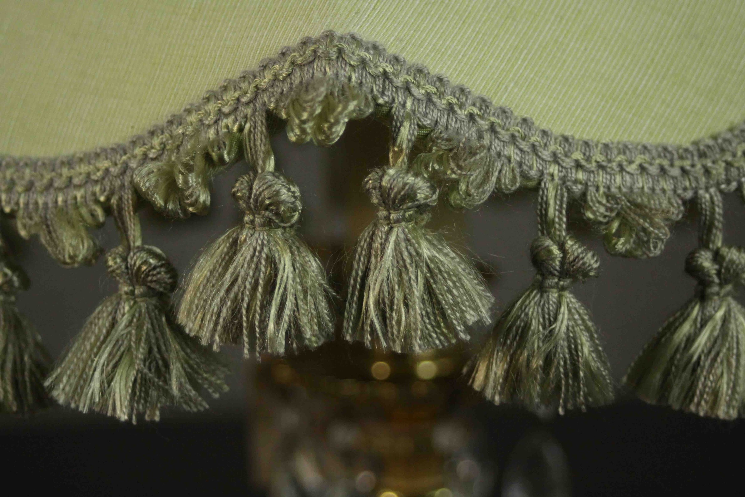 A brass table lamp, hung with faceted glass lustres on a cast feather base, with a pale green shade. - Image 3 of 5