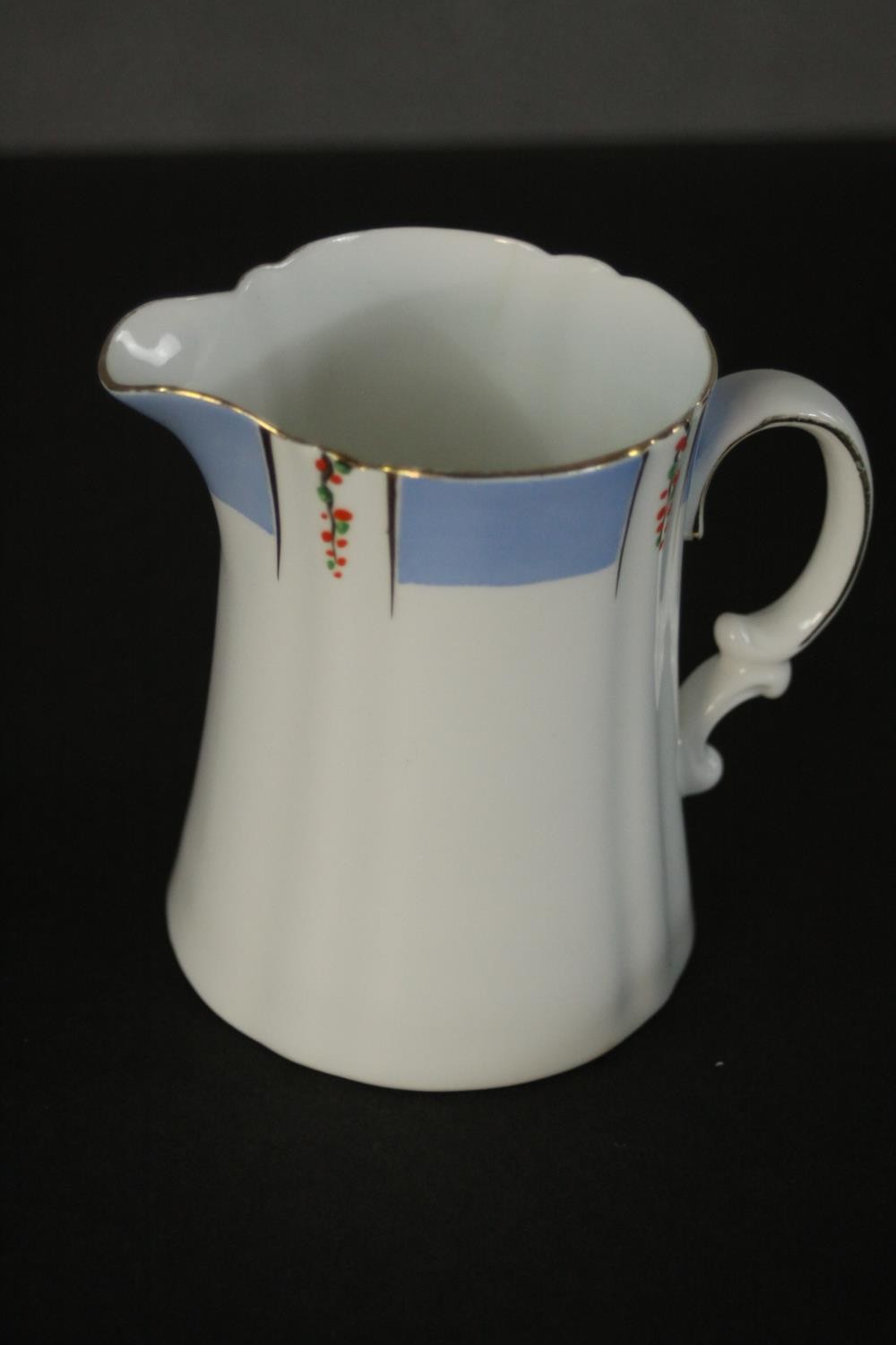 A Heathcote China part tea set, the blue border decorated with trails of flowers. Dia.16cm. ( - Image 2 of 5