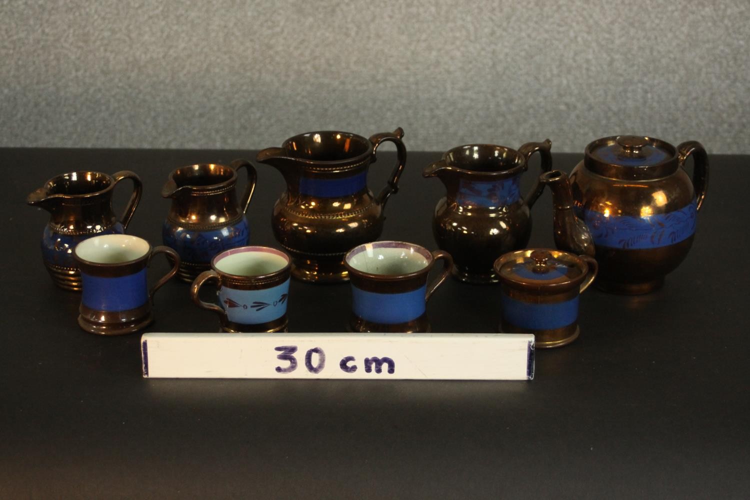 A collection of 19th century copper lustre items, comprising a teapot, jugs, cups, and a preserve - Image 2 of 8