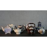 A collection of eight 19th and 20th century tea pots, including a barge ware ceramic tea pot and