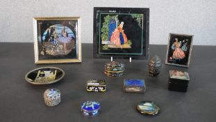 A collection of enamel boxes, butterfly wing plaques and Russian boxes. H.15 W.16.5cm (largest)