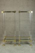 A pair of Pierre Vandel, Paris perspex side plant tables with a brass and chrome frame and two