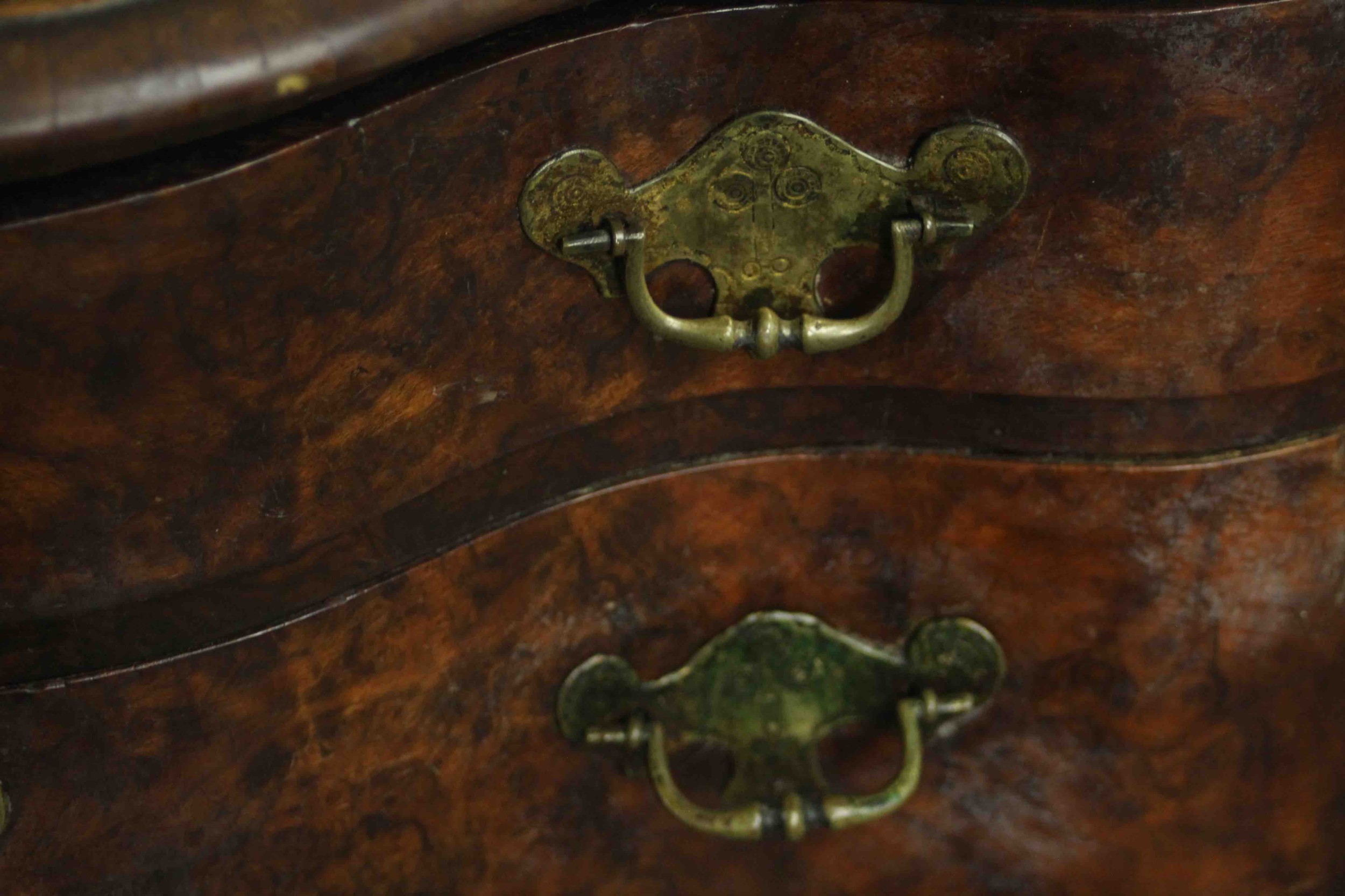 An early 18th century figured walnut lowboy of serpentine form, the top with a moulded edge over two - Image 7 of 8