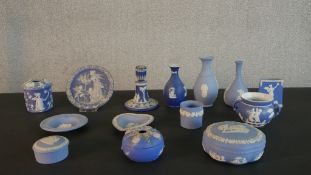 A collection of Wedgwood Jasperware items, including vases, boxes and covers, a candlestick and