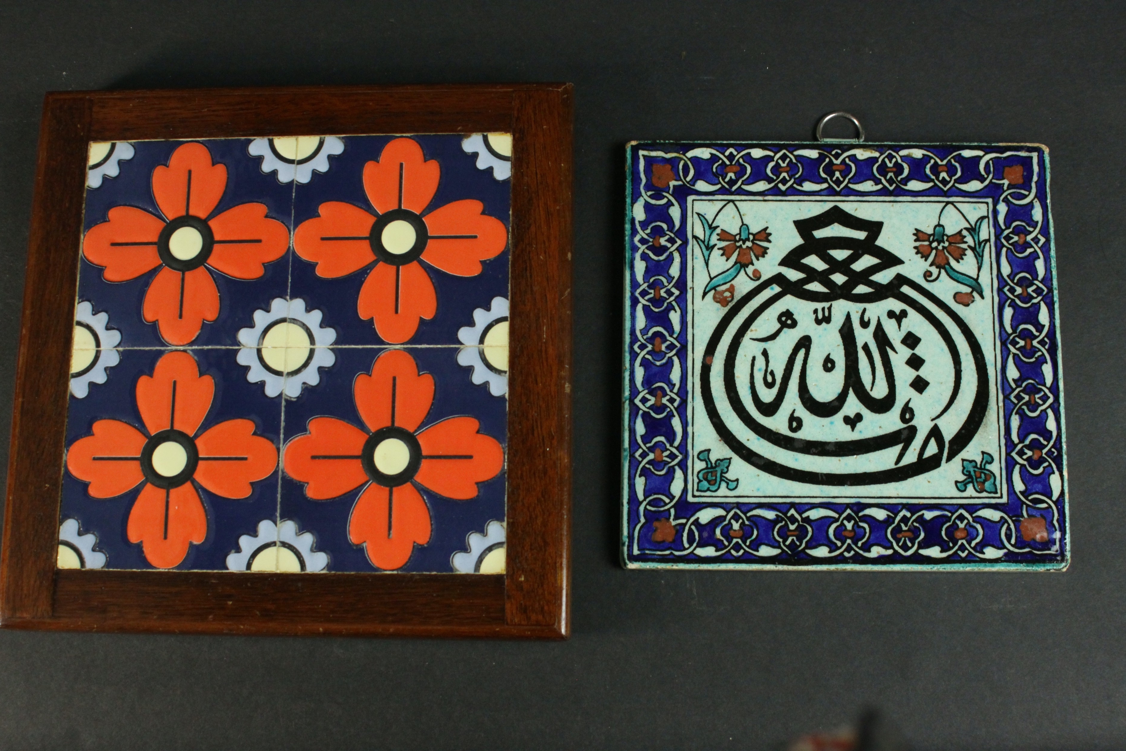 A framed Greek floral design ceramic tile by Arthur Zaaro along with an Indo-Persian calligraphic