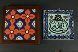 A framed Greek floral design ceramic tile by Arthur Zaaro along with an Indo-Persian calligraphic