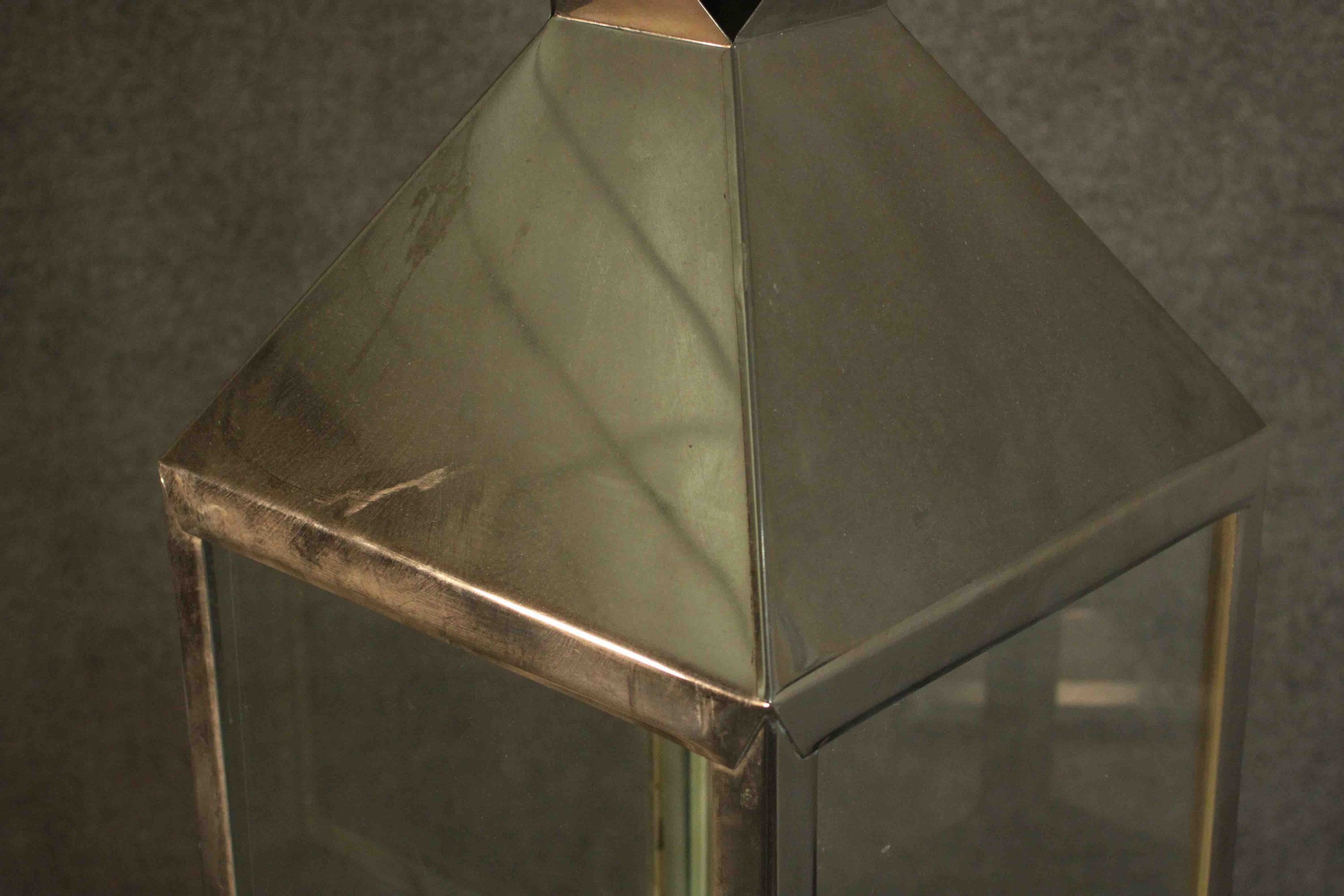 A contemporary nickel plated storm lantern, with a loop handle above a sloped top, with four - Image 4 of 5