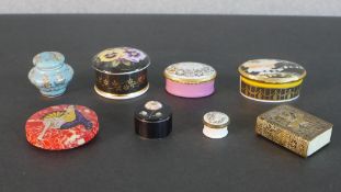 A collection of trinket boxes, including two Halcyon Days enamel boxes, a brass repousse match box