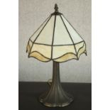 A reproduction Tiffany style table lamp with a cream coloured stained glass shade. H.47 Dia.29cm.
