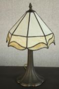 A reproduction Tiffany style table lamp with a cream coloured stained glass shade. H.47 Dia.29cm.