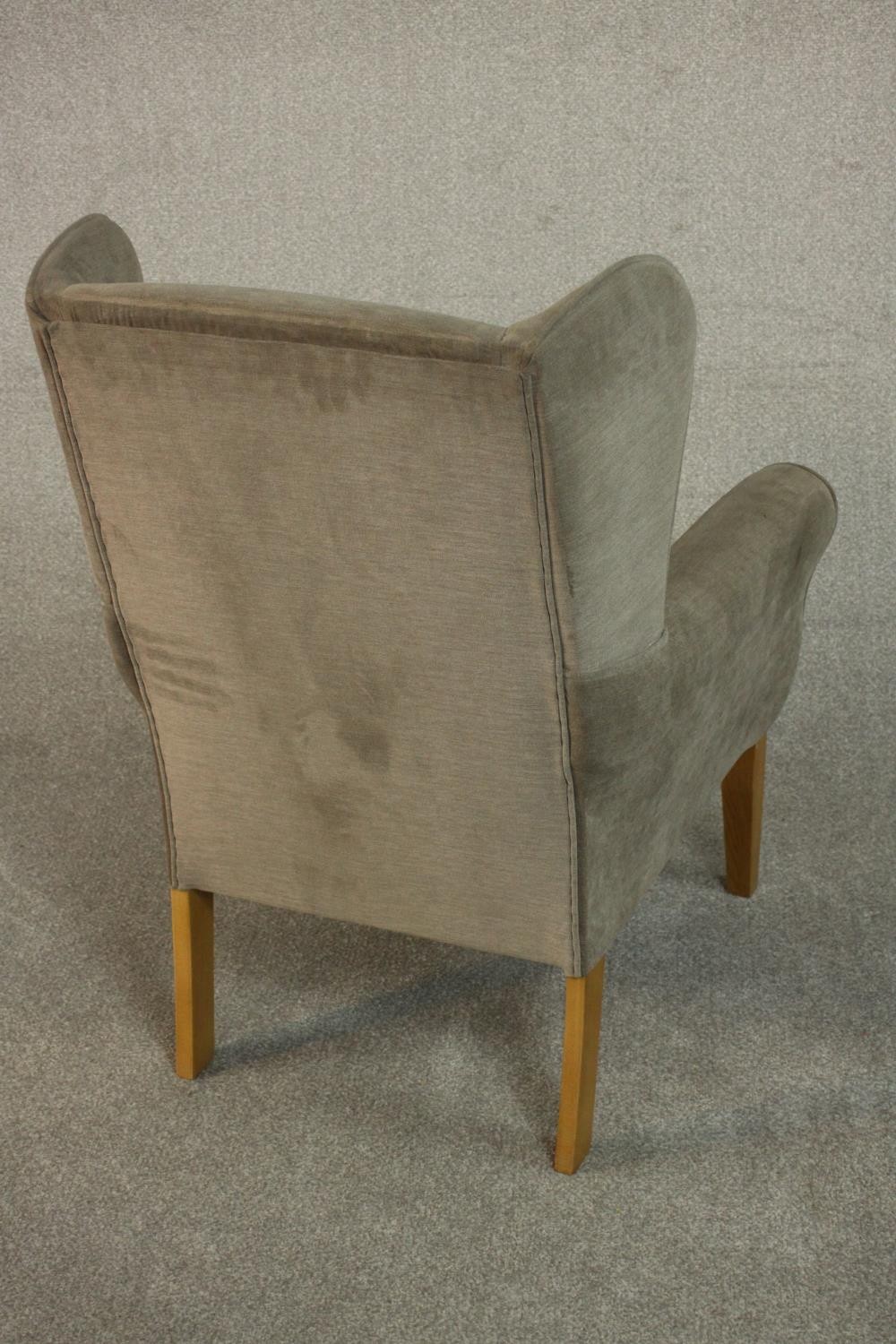 A contemporary wingback armchair in velour upholstery. - Image 5 of 6