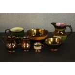 A collection of 19th century copper lustre items, comprising bowls, jugs and mugs. H.17 W.19 D.14cm.