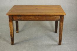 A Victorian pine kitchen table, the rectangular plank top on square section tapering legs. H.74 W.