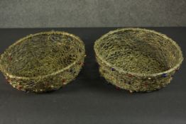 Two African brass wire and bead baskets. H.9 W.26 D.22cm.