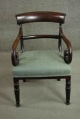 A Regency mahogany bar back open armchair, with scroll arms and upholstered in light green fabric,