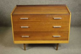 A circa 1960s Stag Furniture teak chest, with a three quarter gallery over three long graduated