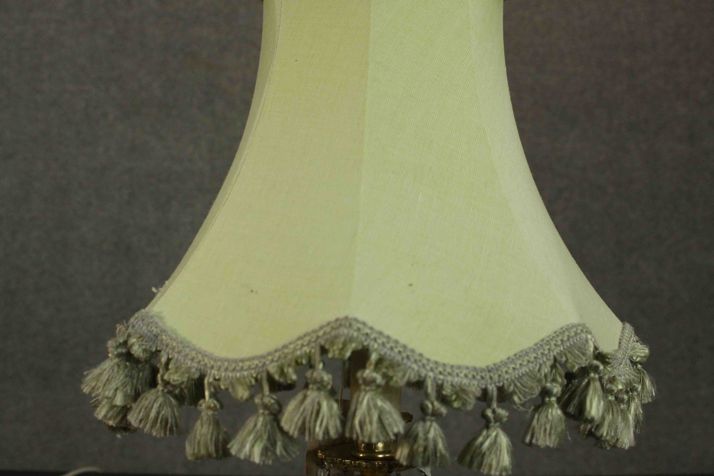 A brass table lamp, hung with faceted glass lustres on a cast feather base, with a pale green shade. - Image 4 of 5