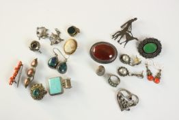 A collection of silver and costume jewellery, including an Art Deco silver brooch of a lady