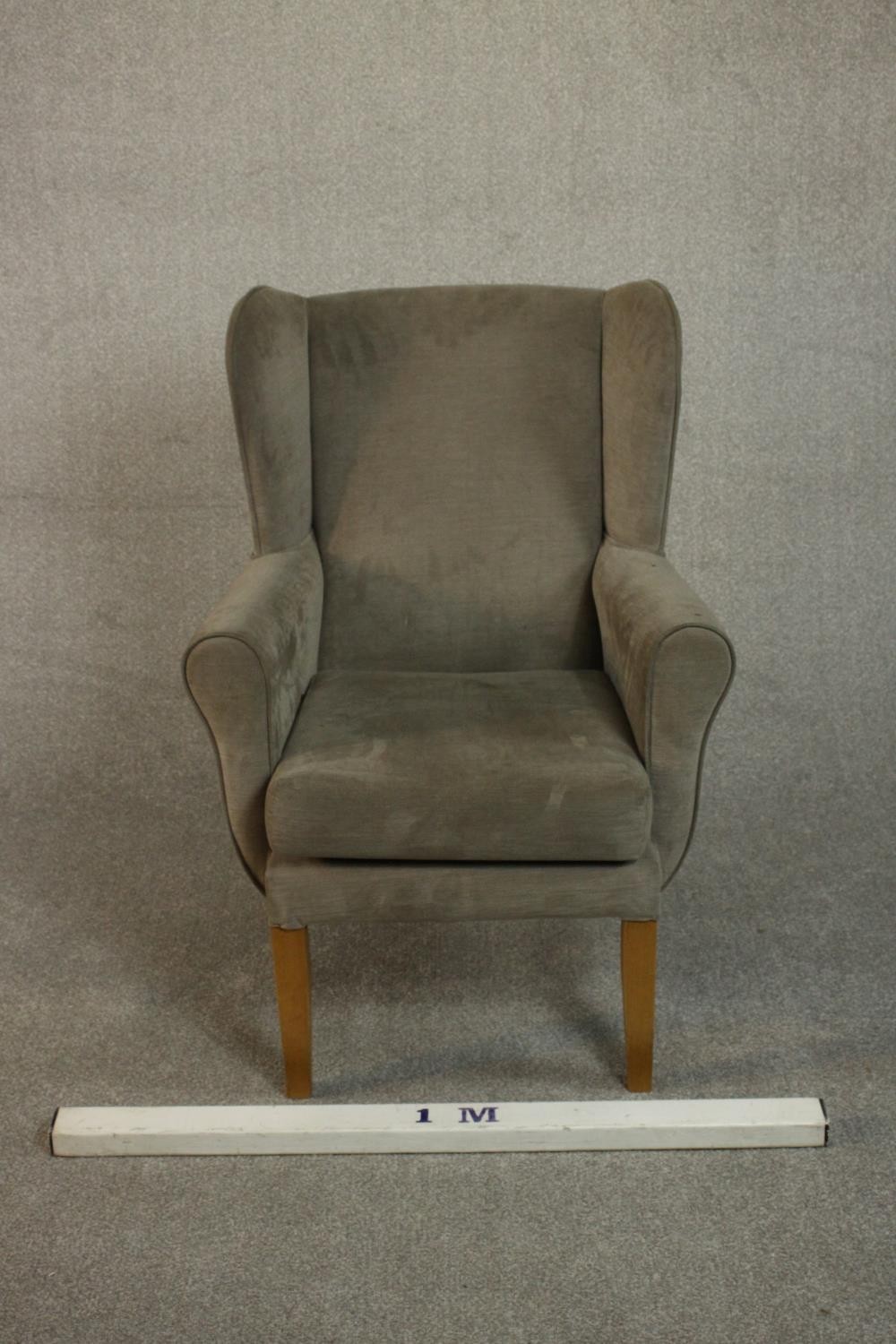 A contemporary wingback armchair in velour upholstery. - Image 2 of 6