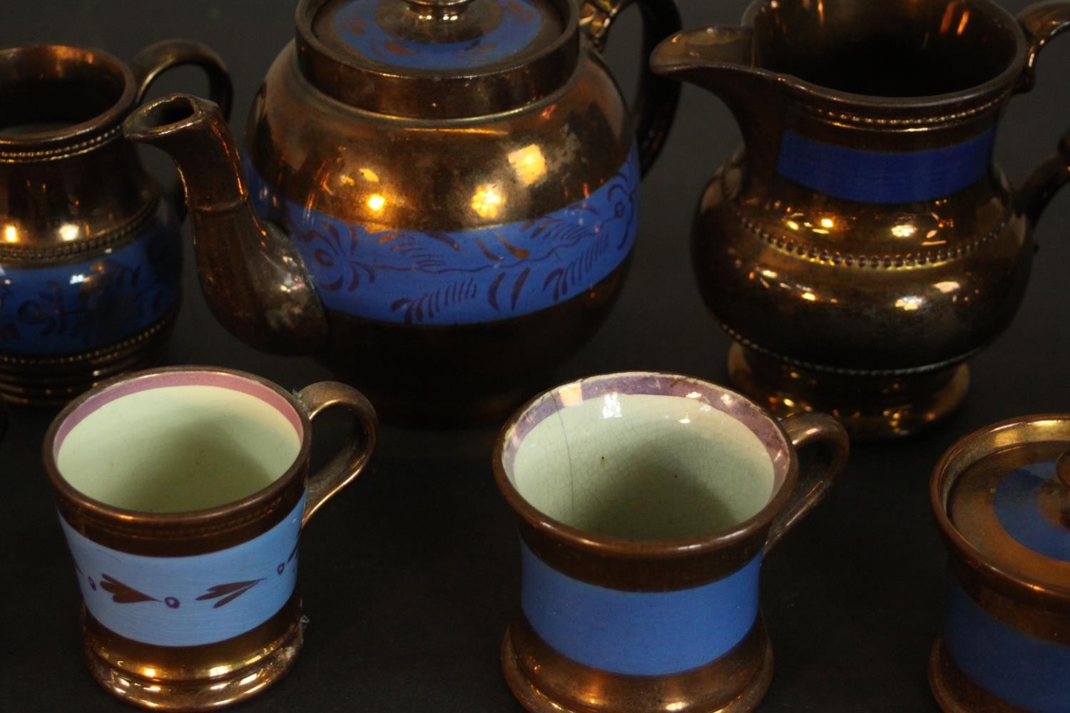 A collection of 19th century copper lustre items, comprising a teapot, jugs, cups, and a preserve - Image 4 of 8