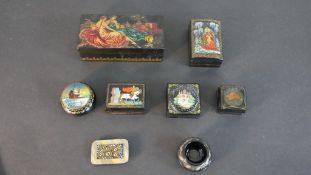 A collection of hand painted Russian boxes with various designs. H.4.5 W.16 D.8cm (largest)