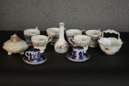 A collection of ceramics, including two blue and white willow pattern coffee cups and saucers, a