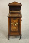 A late Victorian rosewood coal purdonium with satinwood and bone inlaid fall front revealing metal