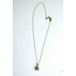 A 9ct gold fine trace chain and pendant with pink cubic zirconia. Stamped 9ct, 375.