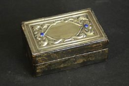 An Italian repousse silver and leather jewellery box with lapis lazuli cabochon detailing along with