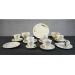 A collection of hand painted Art Deco cups, saucers and plates. Makers include Myott & Sons and
