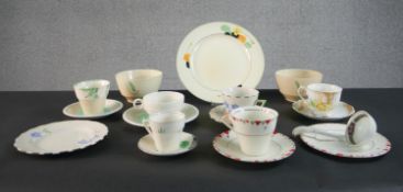 A collection of hand painted Art Deco cups, saucers and plates. Makers include Myott & Sons and