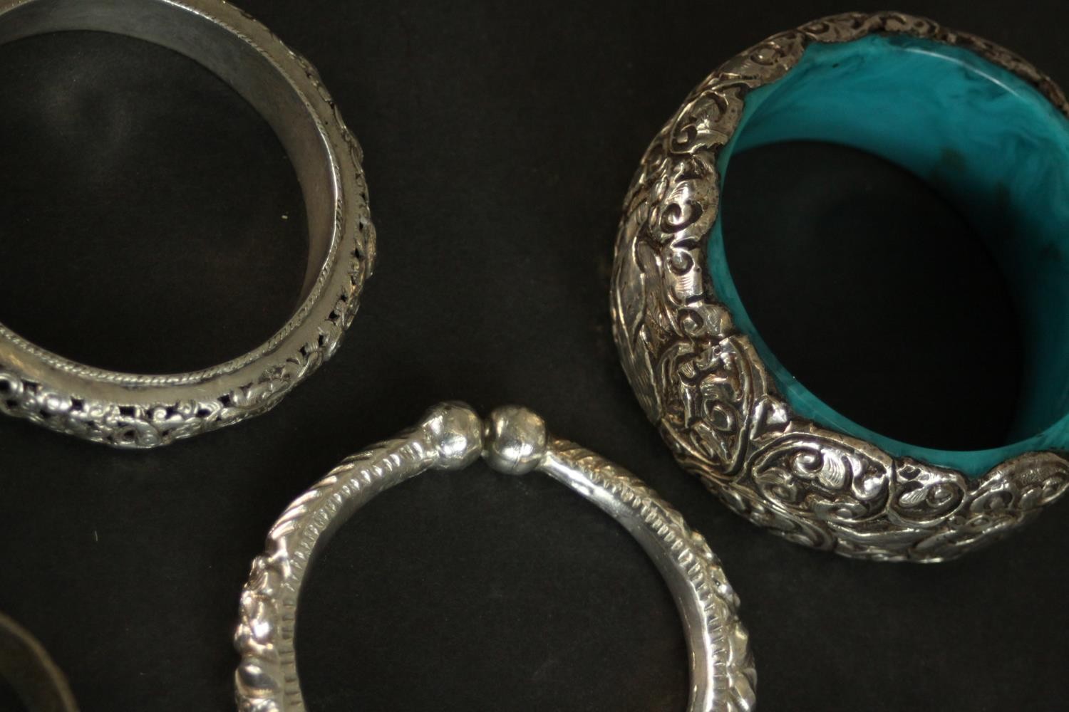 A collection of five white metal Oriental bangles and three silver plated bangles. A pair of Chinese - Image 4 of 8