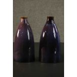 A pair of contemporary ceramic vases, with experimental glaze in hues of purple. H.30 W.16 D.8cm. (