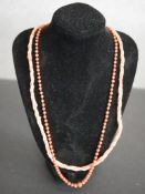 Two coral necklaces, a Victorian graduated coral bead necklace with yellow metal push clasp and