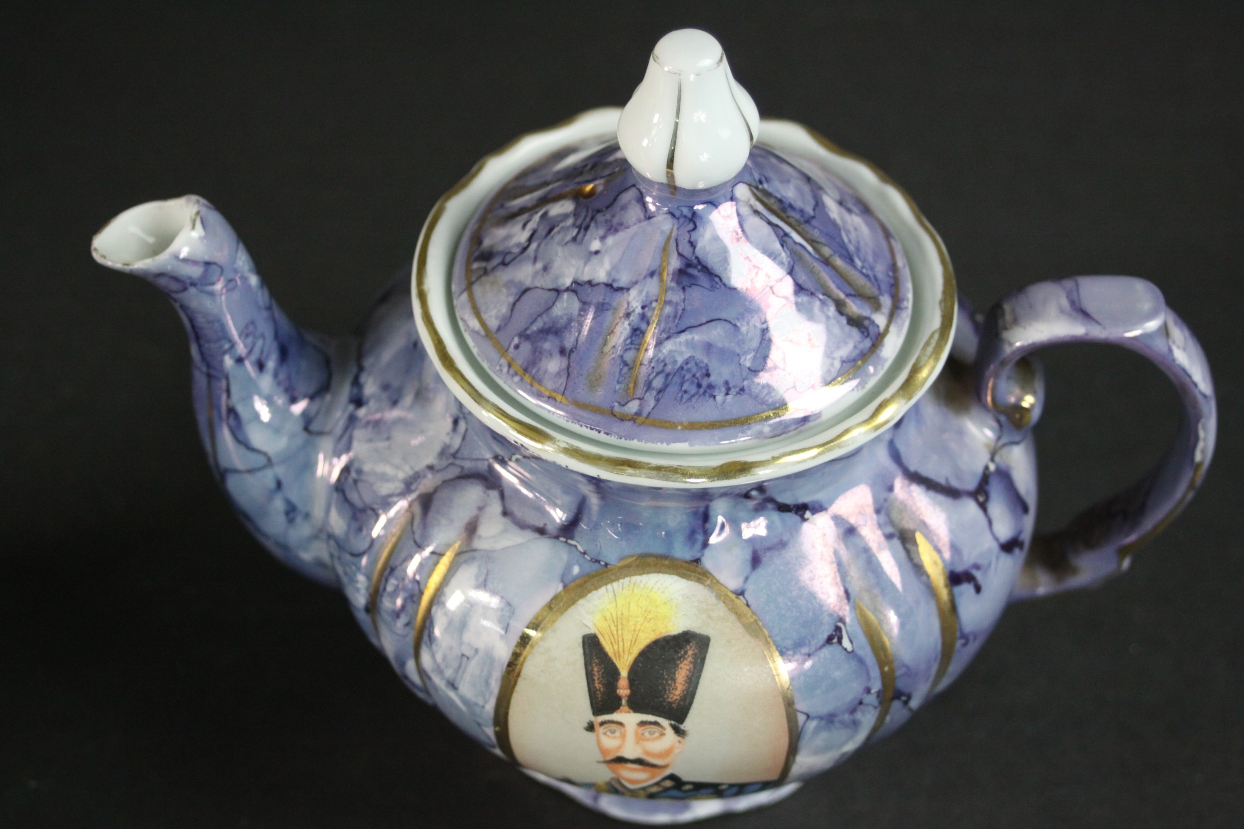 Three porcelain and pottery teapots, two made for the Persian market with portraits of Naser al- - Image 5 of 9