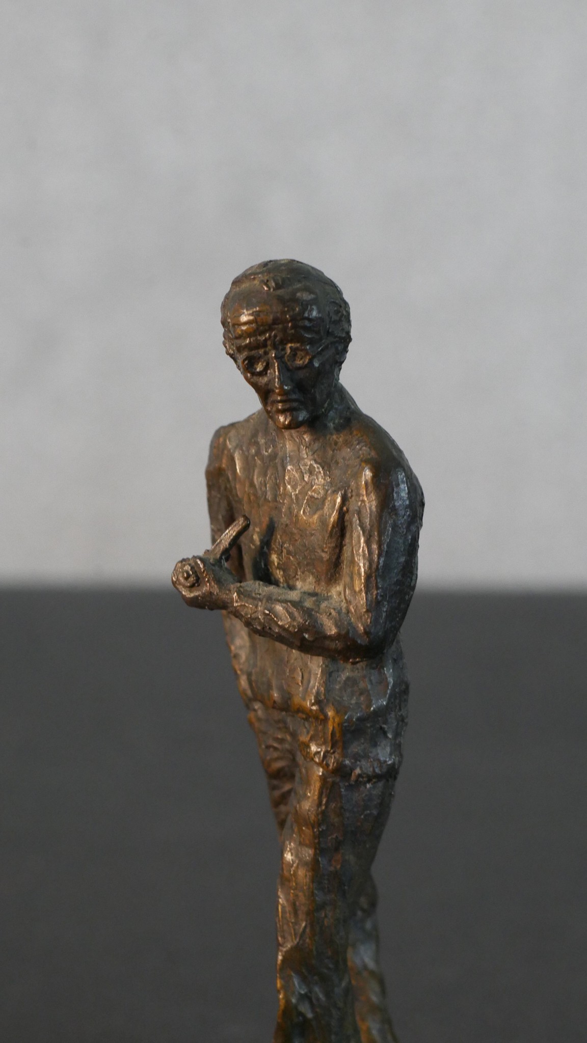 A bronze figure of a man smoking a pipe along with a spelter figure of a female swimmer (arm broken) - Image 3 of 8