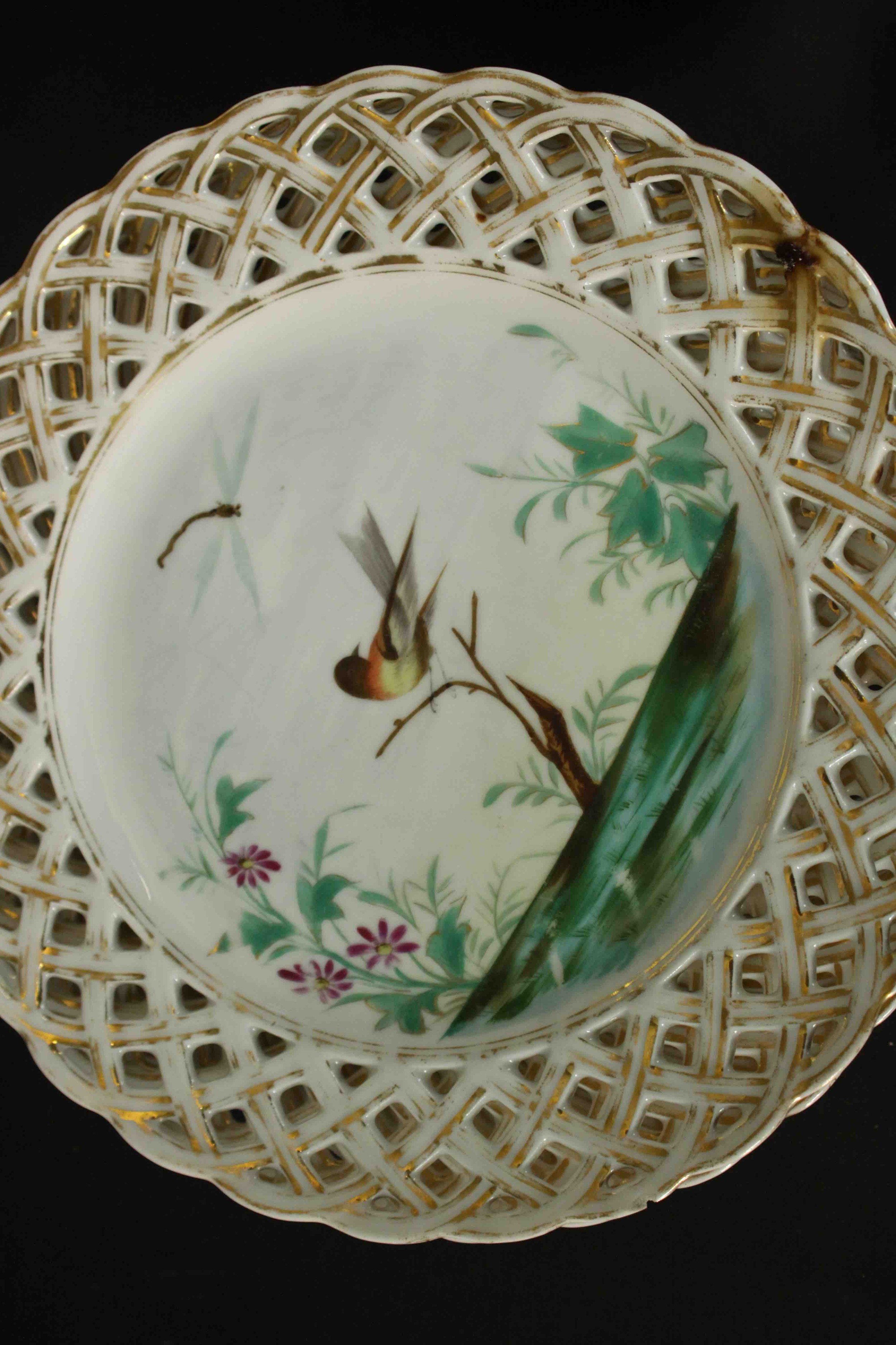 A set of eleven 19th century hand painted porcelain plates with pierced gilded lattice work rims and - Image 4 of 6