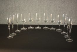A set of six Rosenthal studio line champagne glasses along with a set of six Reidel wine glasses.