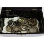 A Chinese purple lacquered jewellery box containing a collection of Oriental and Tribal jewellery,