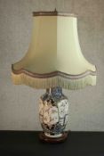 A Japanese porcelain vase table lamp with blue and white foliate designs and foliate reserves,