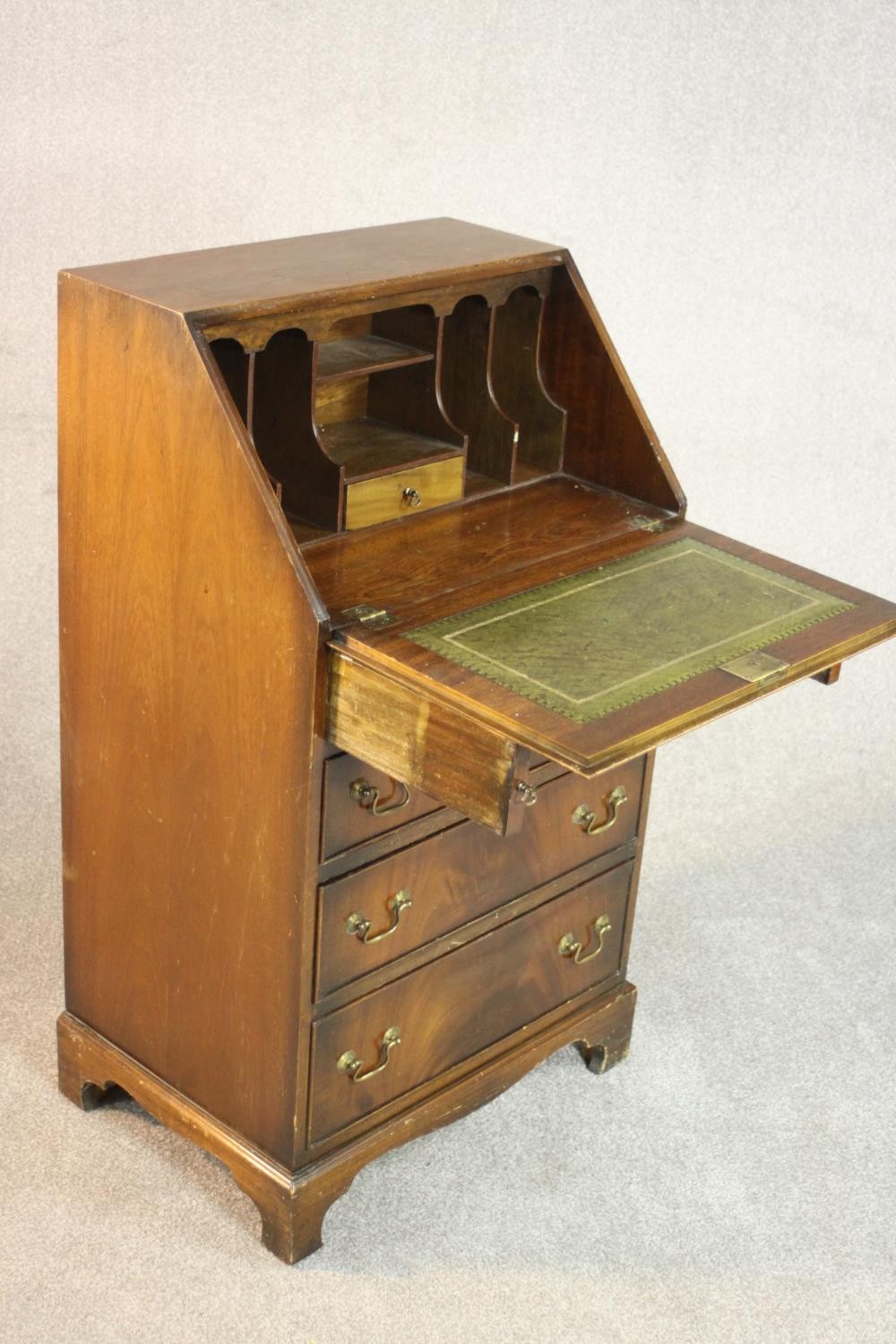 A George III style mahogany bureau, the fall front enclosing a drawer and pigeonholes, over four - Image 6 of 7