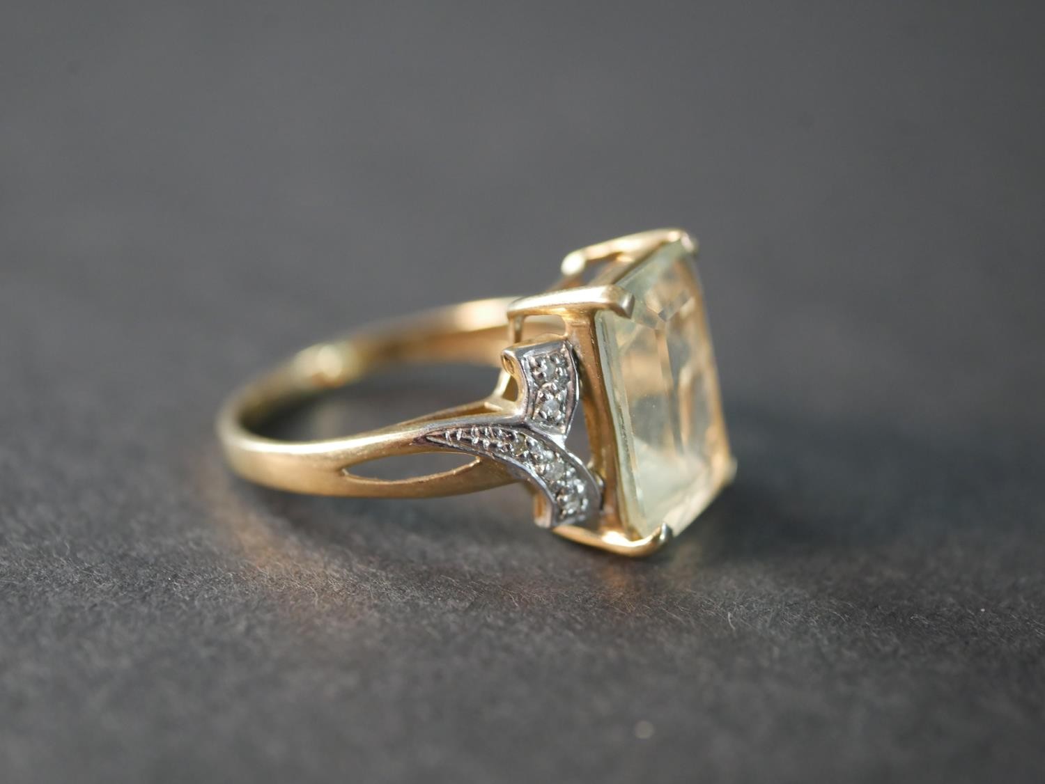 A 9 carat topaz and diamond dress ring, set to centre with a rectangular emerald cut topaz with an - Image 3 of 4