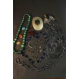 A collection of gemstone necklaces and other jewellery. A graduated carved malachite bead