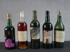 A collection of five bottles of vintage wine and port.