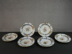 A set of six 19th century Wedwood Pearlware plates, decorated with flowers and gilded detail,