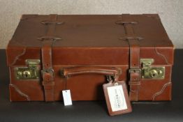 A lockable hand-crafted Balvenie Ambassador brown leather travel case. The case contains bespoke