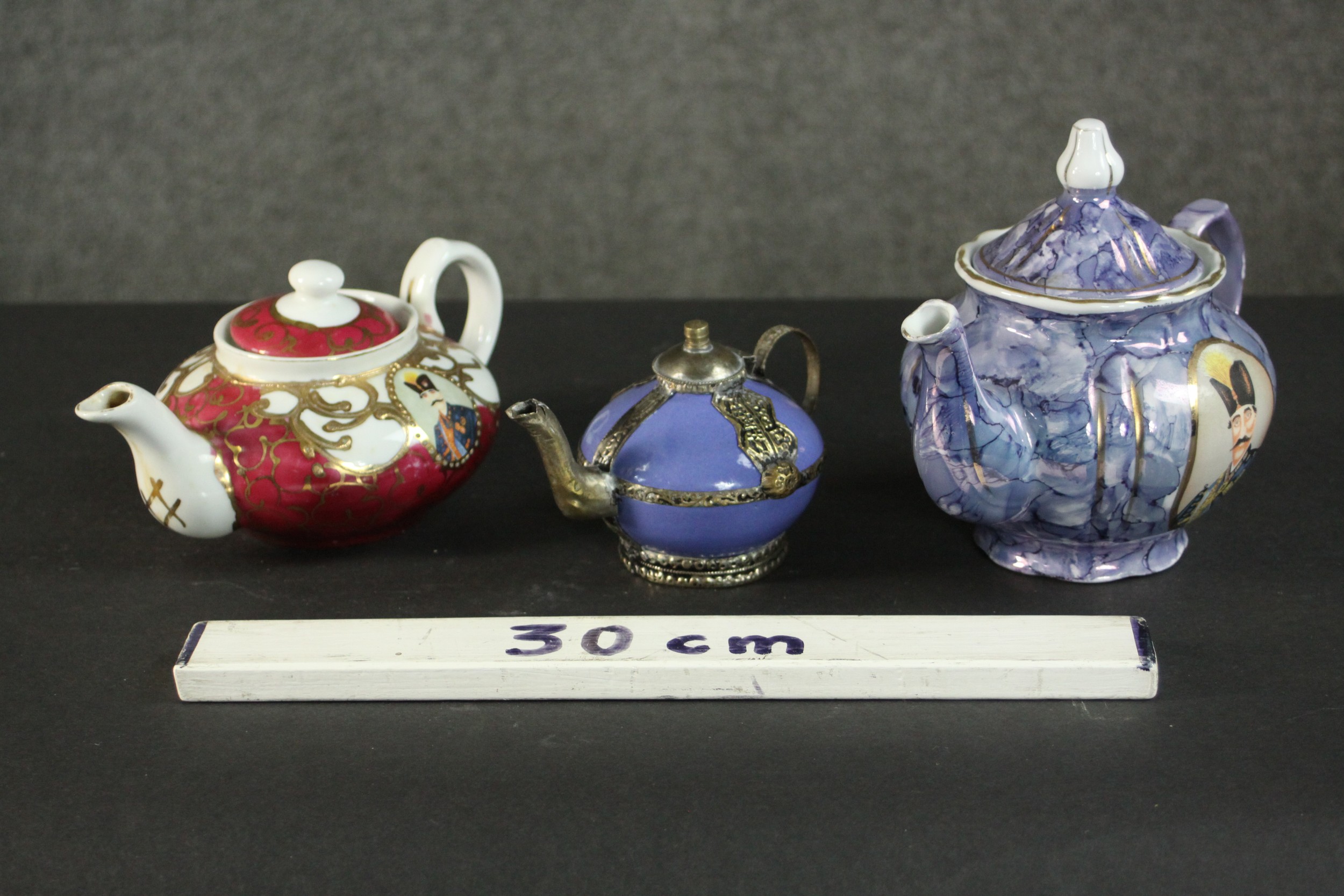 Three porcelain and pottery teapots, two made for the Persian market with portraits of Naser al- - Image 2 of 9