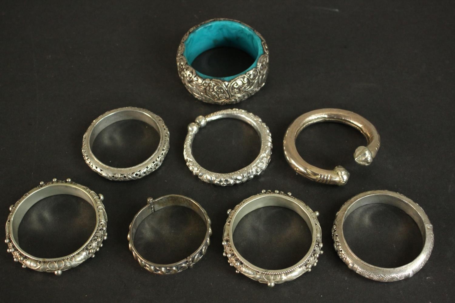 A collection of five white metal Oriental bangles and three silver plated bangles. A pair of Chinese - Image 8 of 8