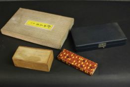 A collection of vintage games, including a vintage boxed set of Go, a set of acrylic chips, a