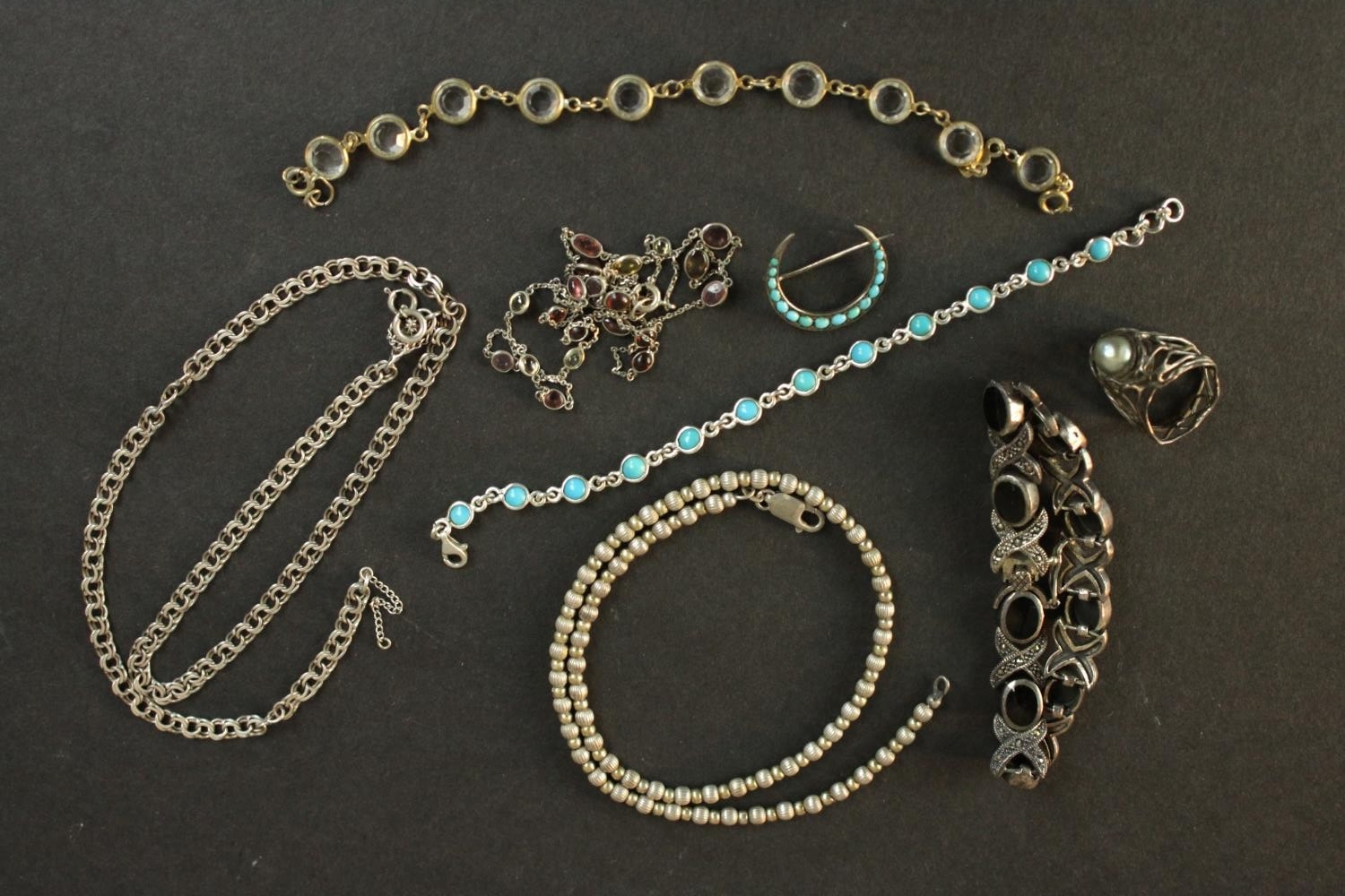A collection of silver and costume jewellery, including a silver and gemstone spectacle chain, a